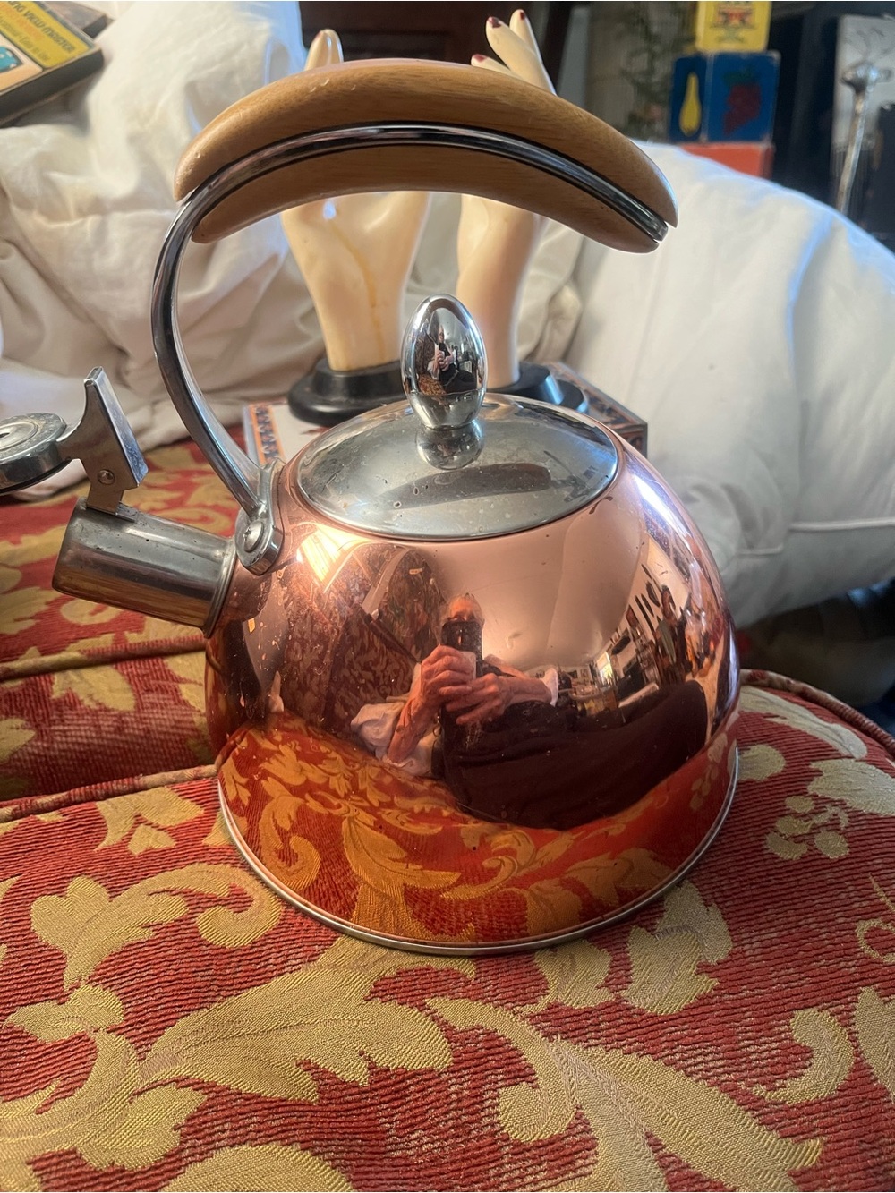 Copper Whistling Tea Kettle with Wood-Tone Handle - pinky up